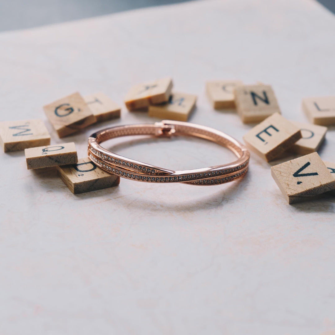 Rose Gold Plated Crossover Bangle Created with Zircondia® Crystals (7 Inch) - Philip Jones Jewellery