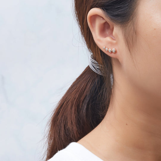 Rose Gold Plated Four Stone Climber Earrings Created With Zircondia® Crystals - Philip Jones Jewellery