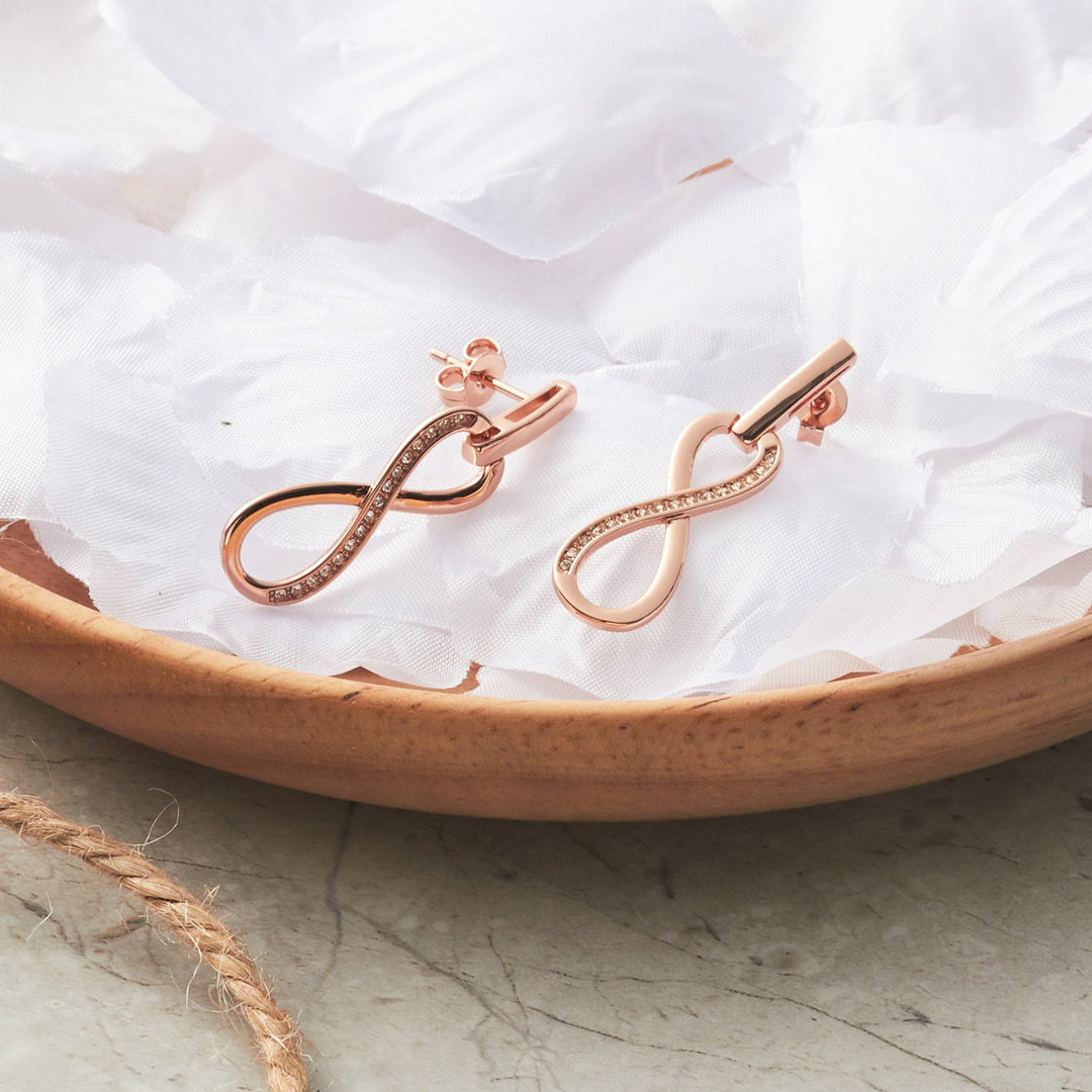 Rose Gold Plated Infinity Drop Earrings Created with Zircondia® Crystals - Philip Jones Jewellery