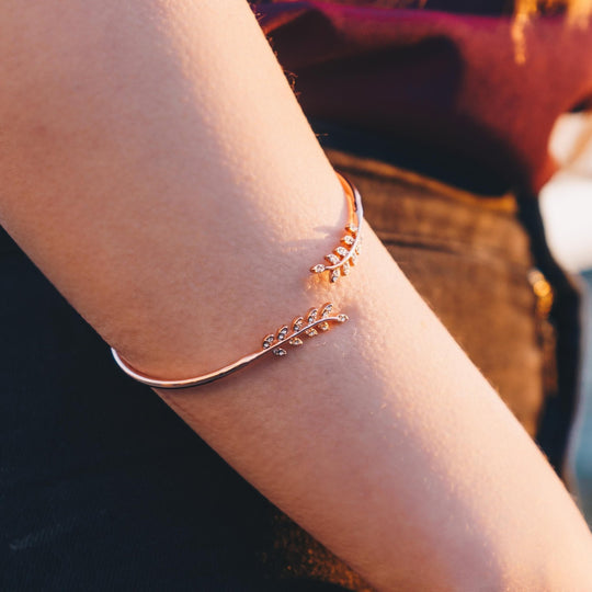Rose Gold Plated Leaf Bangle Created with Zircondia® Crystals - Philip Jones Jewellery
