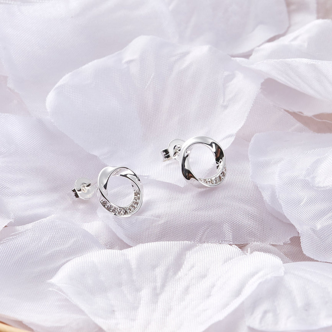 Silver Plated Circle Twist Earrings Created with Zircondia® Crystals - Philip Jones Jewellery
