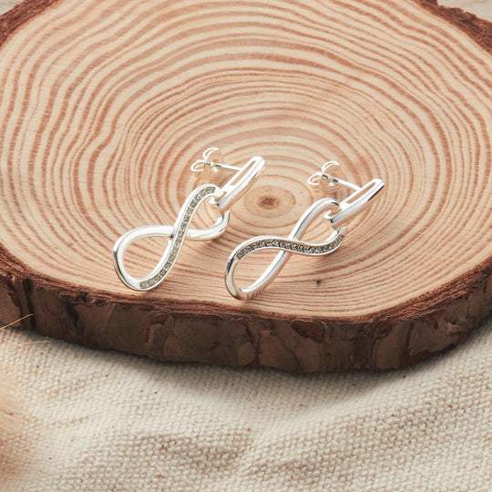 Silver Plated Infinity Drop Earrings Created with Zircondia® Crystals - Philip Jones Jewellery
