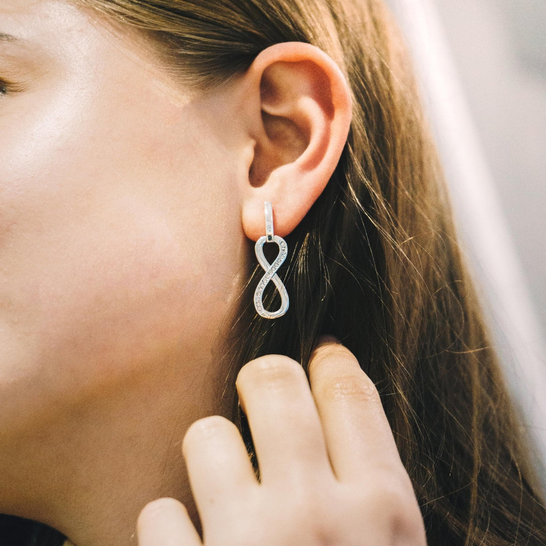 Silver Plated Infinity Drop Earrings Created with Zircondia® Crystals - Philip Jones Jewellery