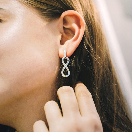 Silver Plated Infinity Drop Earrings Created with Zircondia® Crystals - Philip Jones Jewellery