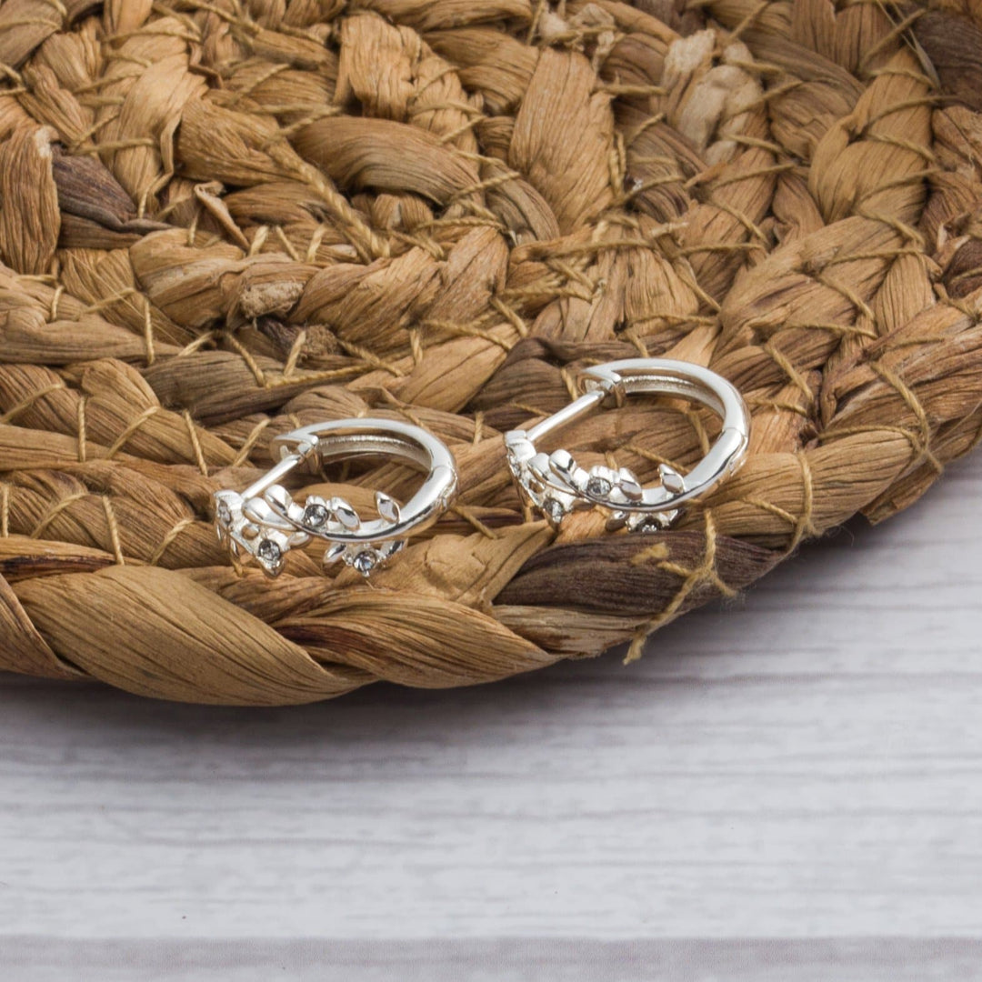 Silver Plated Leaf Hoop Earrings Created with Zircondia® Crystals - Philip Jones Jewellery