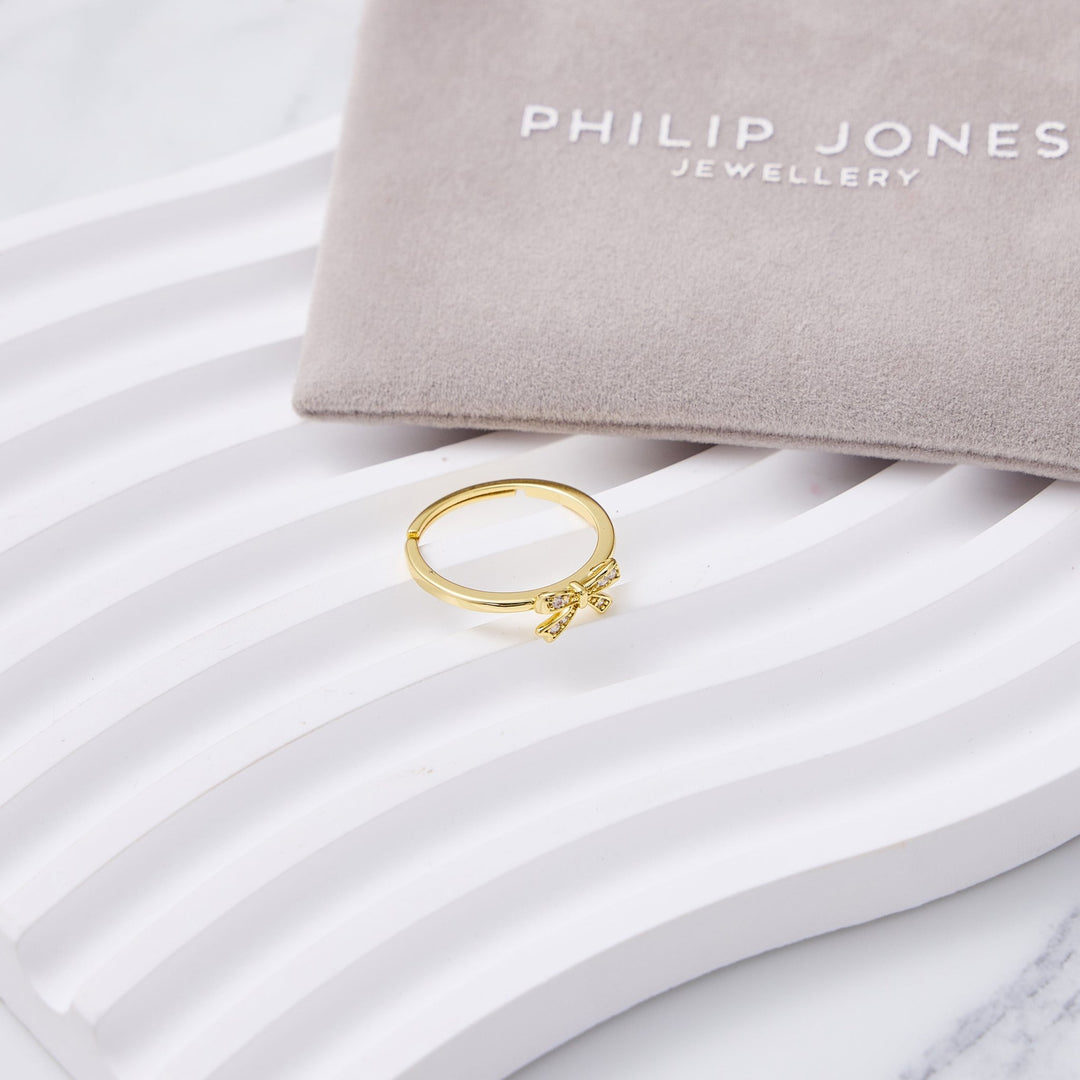 18k Gold Plated Bow Adjustable Ring Created with Zircondia® Crystals - Philip Jones Jewellery