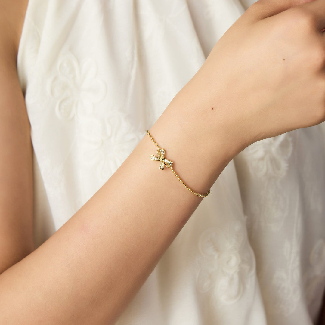 18k Gold Plated Bow Bracelet Created with Zircondia® Crystals - Philip Jones Jewellery