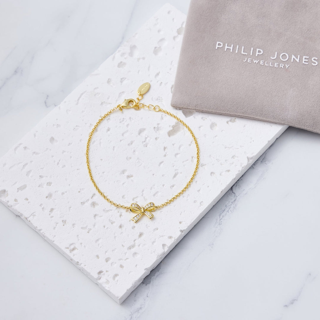 18k Gold Plated Bow Bracelet Created with Zircondia® Crystals - Philip Jones Jewellery