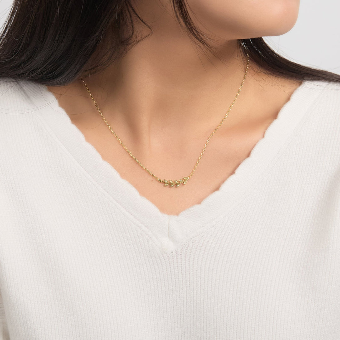 18k Gold Plated Leaf Necklace Created with Zircondia® Crystals - Philip Jones Jewellery