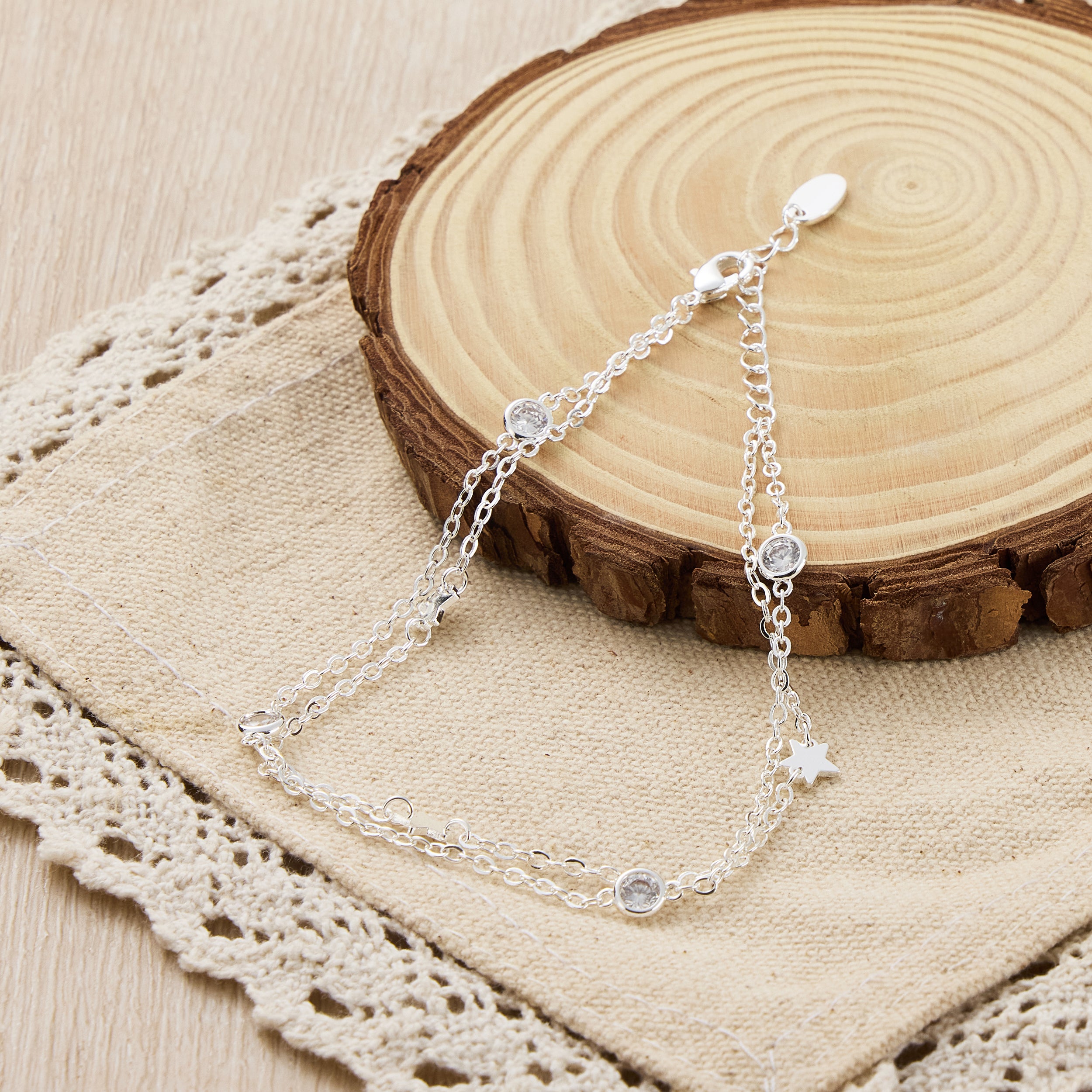 Silver Plated Layered Star Anklet Created with Zircondia® Crystals