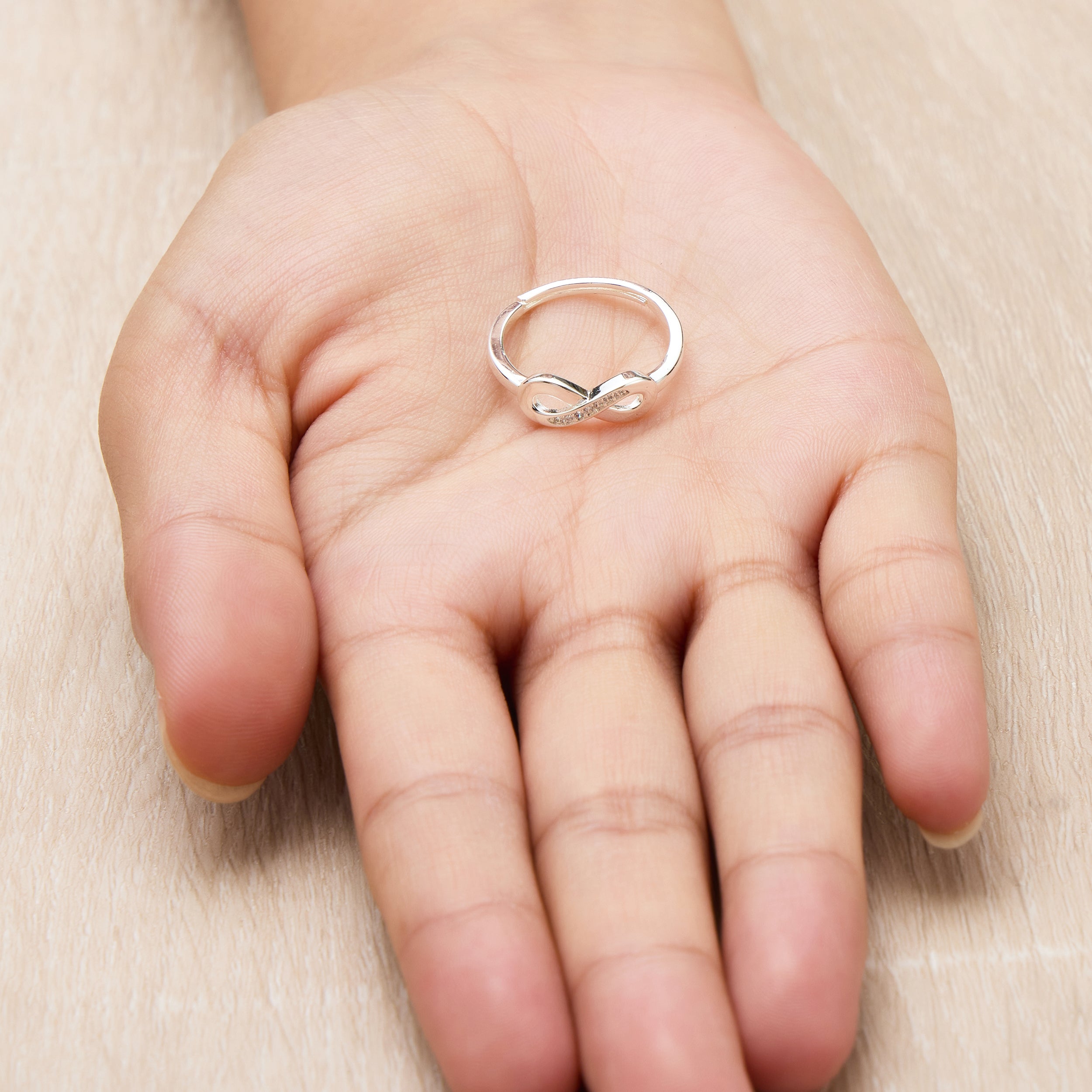 Silver Plated Infinity Ring Created with Zircondia® Crystals