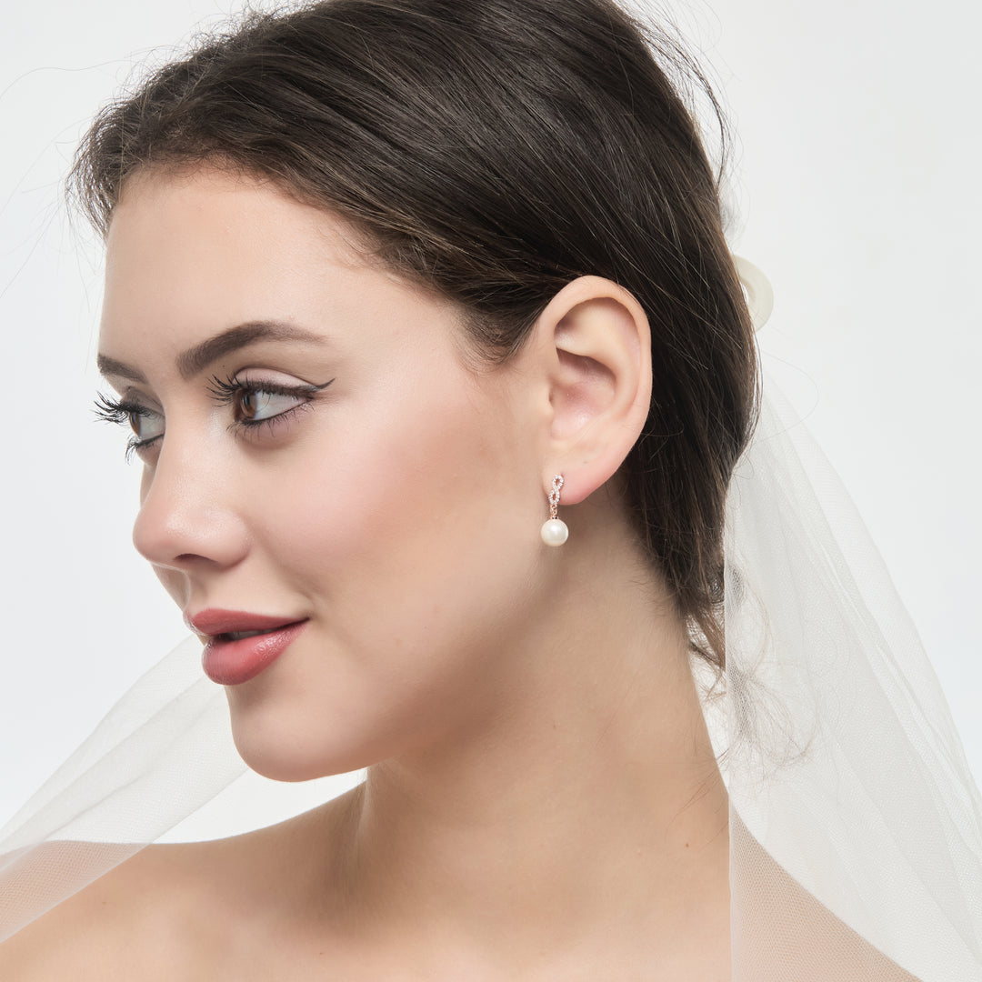 Rose Gold Plated Infinity Pearl Drop Bridal Earrings Created with Zircondia® Crystals