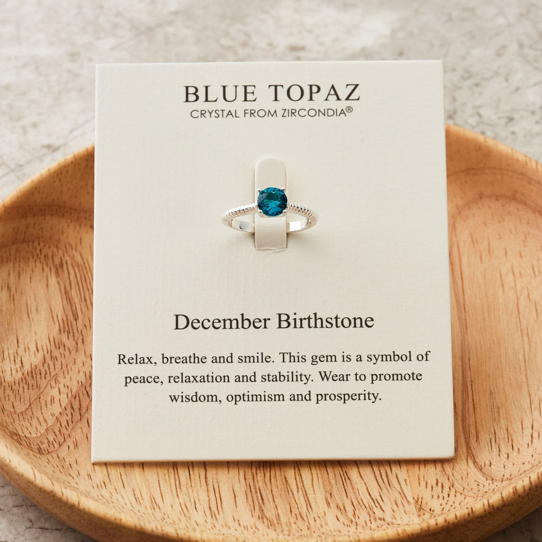 December (Blue Topaz) Adjustable Birthstone Ring Created with Zircondia® Crystals - Philip Jones Jewellery