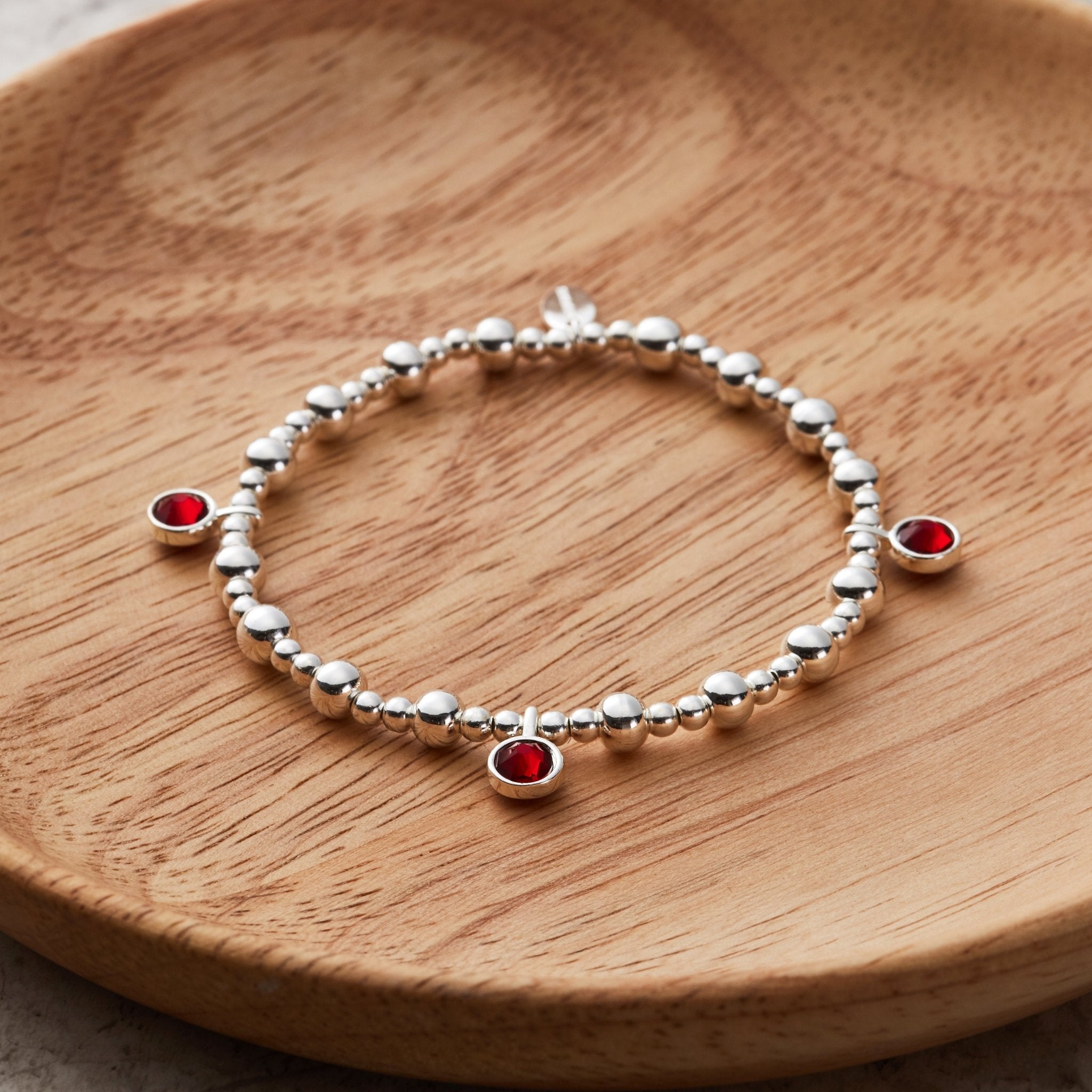 January (Garnet) Birthstone Stretch Charm Bracelet with Quote Gift Box - Philip Jones Jewellery