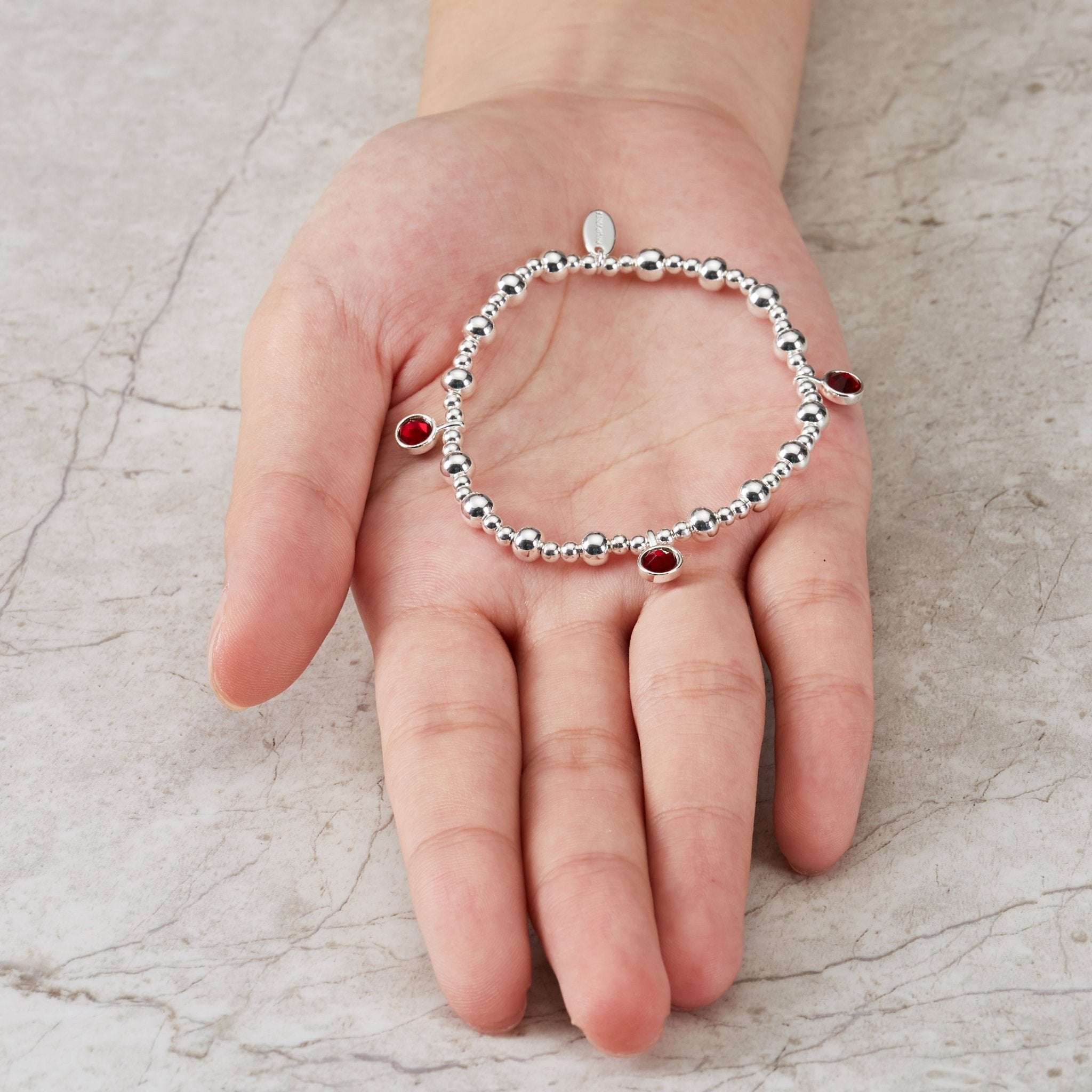 January (Garnet) Birthstone Stretch Charm Bracelet with Quote Gift Box - Philip Jones Jewellery