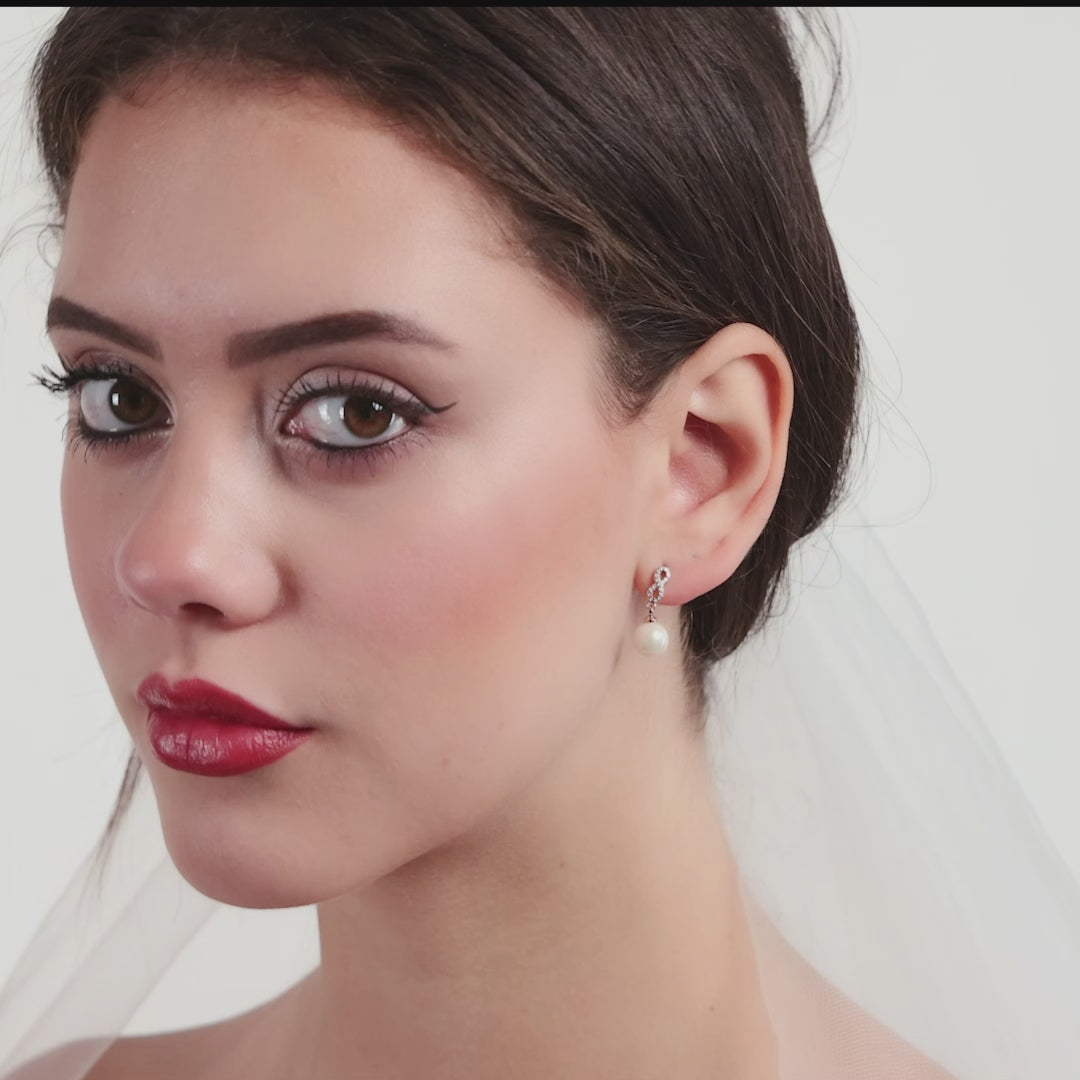 Silver Plated Infinity Pearl Drop Bridal Earrings Created with Zircondia® Crystals