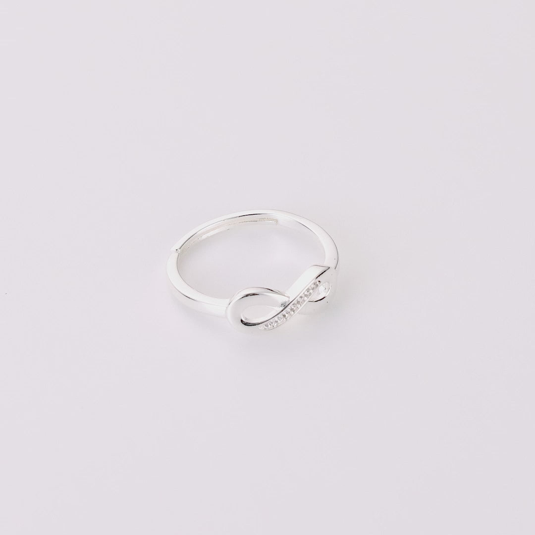 Silver Plated Infinity Ring Created with Zircondia® Crystals