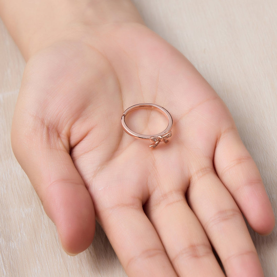 Rose Gold Plated Bow Adjustable Ring Created with Zircondia® Crystals - Philip Jones Jewellery