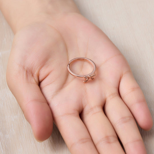 Rose Gold Plated Bow Adjustable Ring Created with Zircondia® Crystals - Philip Jones Jewellery