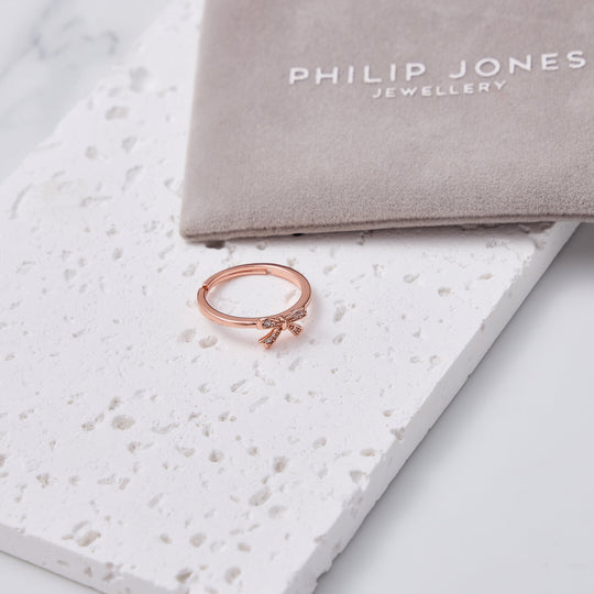 Rose Gold Plated Bow Adjustable Ring Created with Zircondia® Crystals - Philip Jones Jewellery