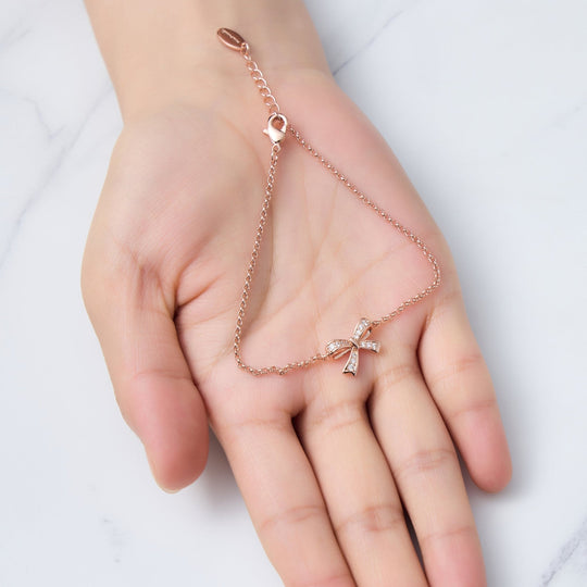 Rose Gold Plated Bow Bracelet Created with Zircondia® Crystals - Philip Jones Jewellery