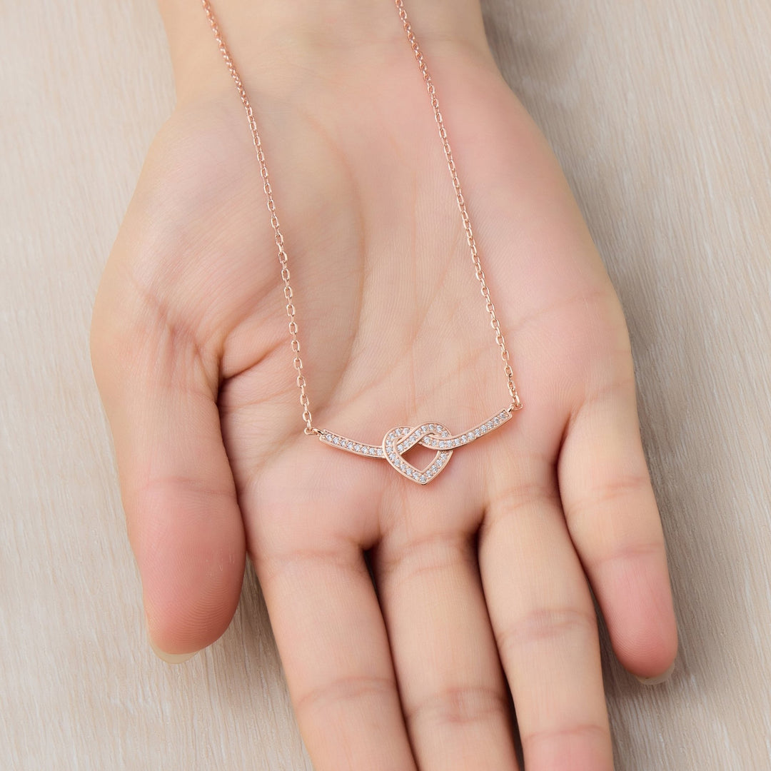 Rose Gold Plated Heart Knot Necklace Created with Zircondia® Crystals - Philip Jones Jewellery