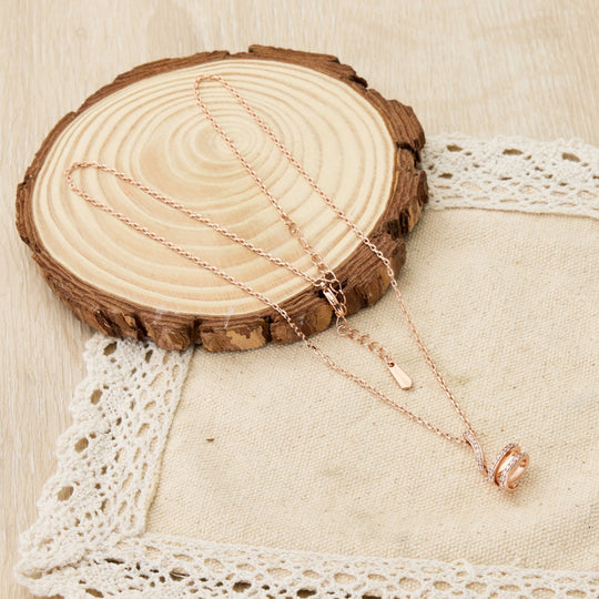 Rose Gold Plated Spiral Twist Necklace Created with Zircondia® Crystals - Philip Jones Jewellery