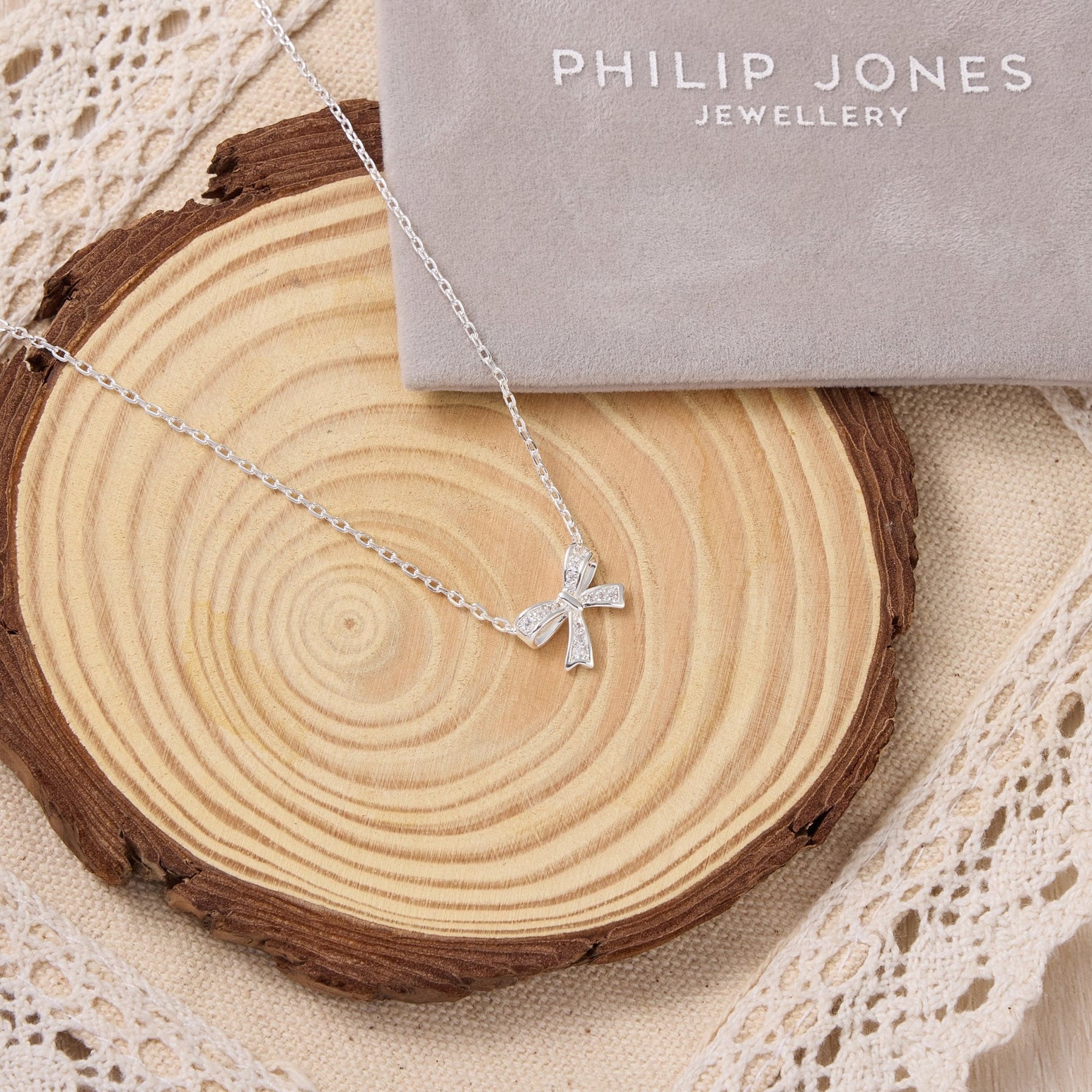 silver plated bow necklace created with zircondia crystals 478298