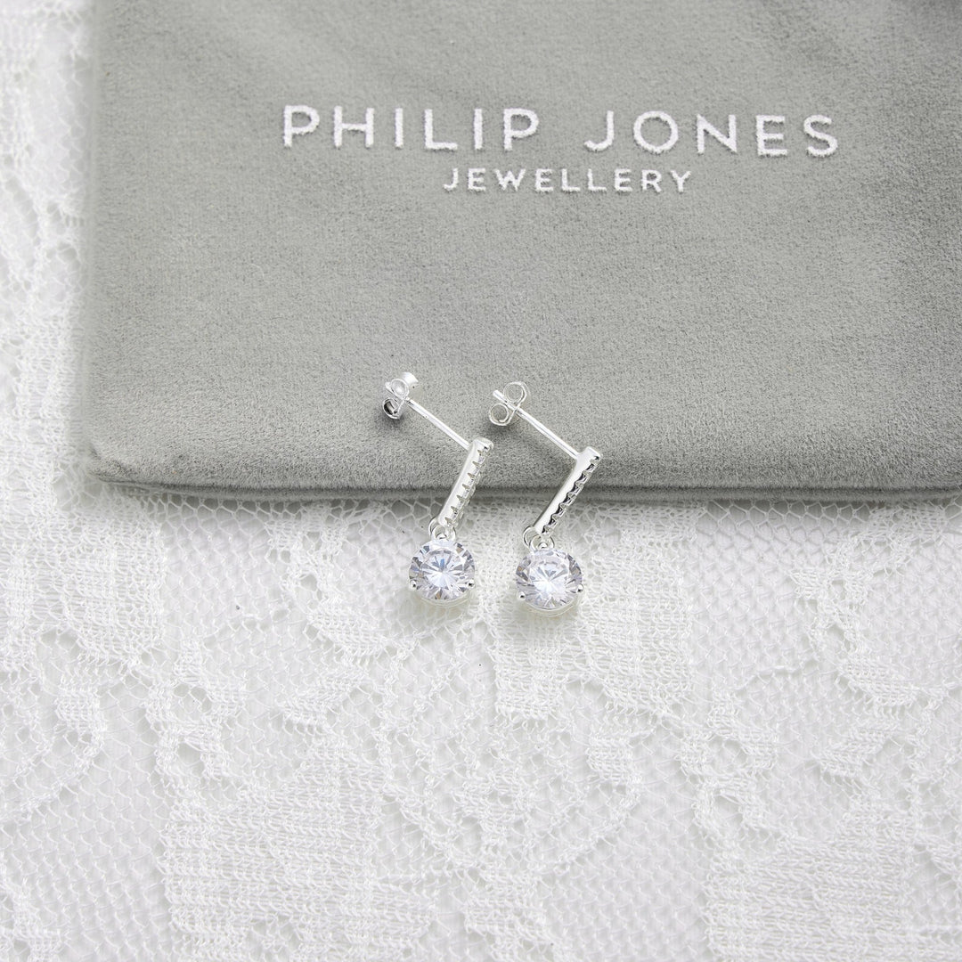 Sterling Silver Solitaire Drop Bridal Earrings Created with Zircondia® Crystals - Philip Jones Jewellery