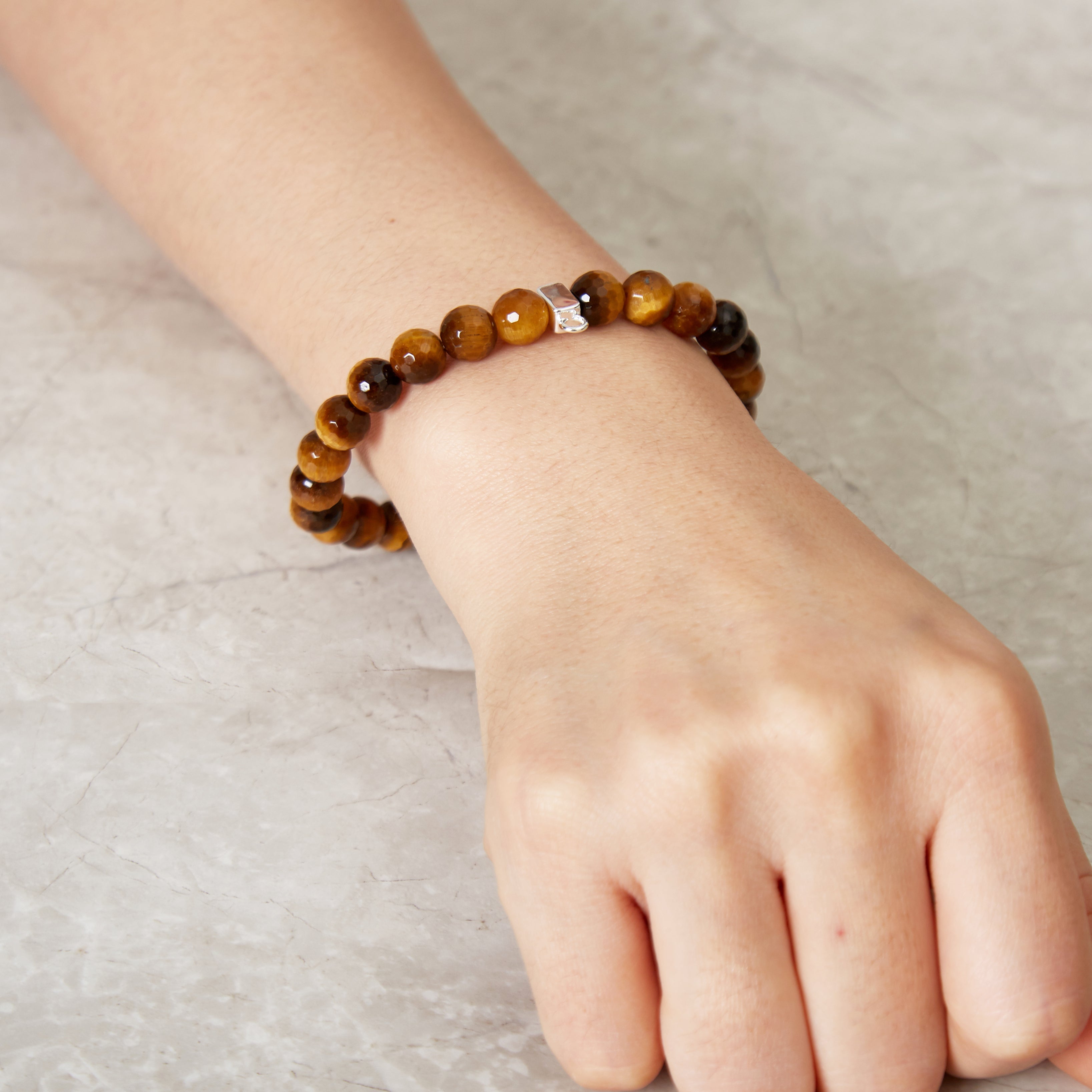 Faceted Tiger's Eye Gemstone Stretch Bracelet with Charm Created with Zircondia® Crystals