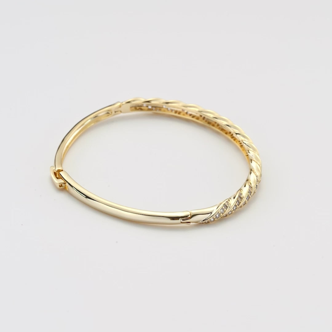 Gold Plated Twist Bangle Created with Zircondia® Crystals Video