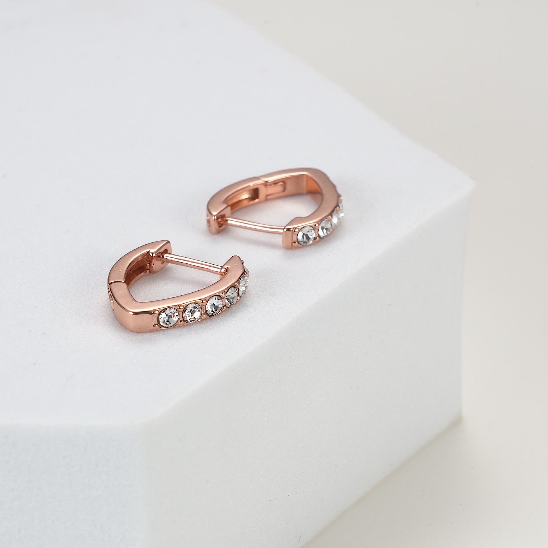 Rose Gold Plated Huggie Hoop Earrings Created with Zircondia® Crystals
