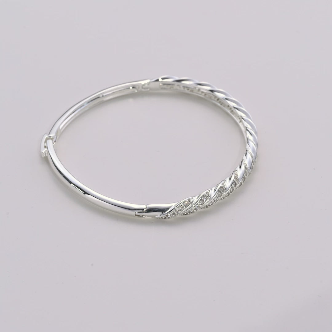 Silver Plated Twist Bangle Created with Zircondia® Crystals Video