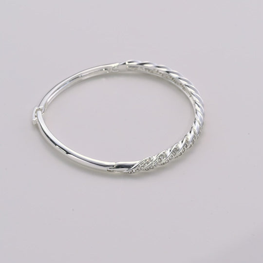 Silver Plated Twist Bangle Created with Zircondia® Crystals Video
