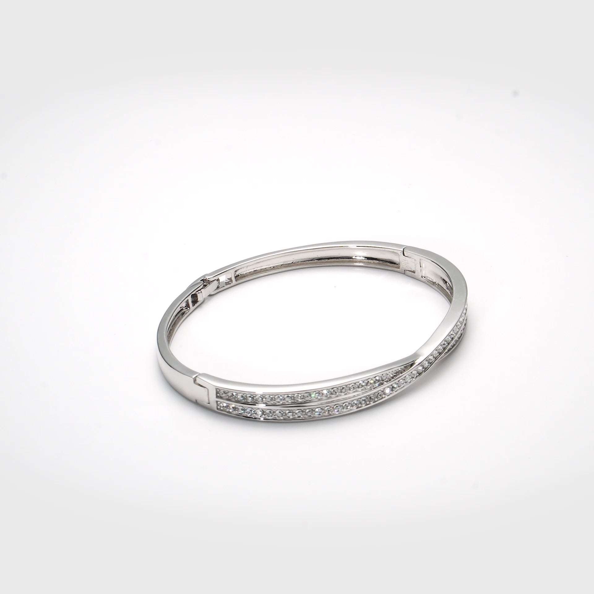 Silver Plated Crossover Bangle Created with Zircondia® Crystals Video