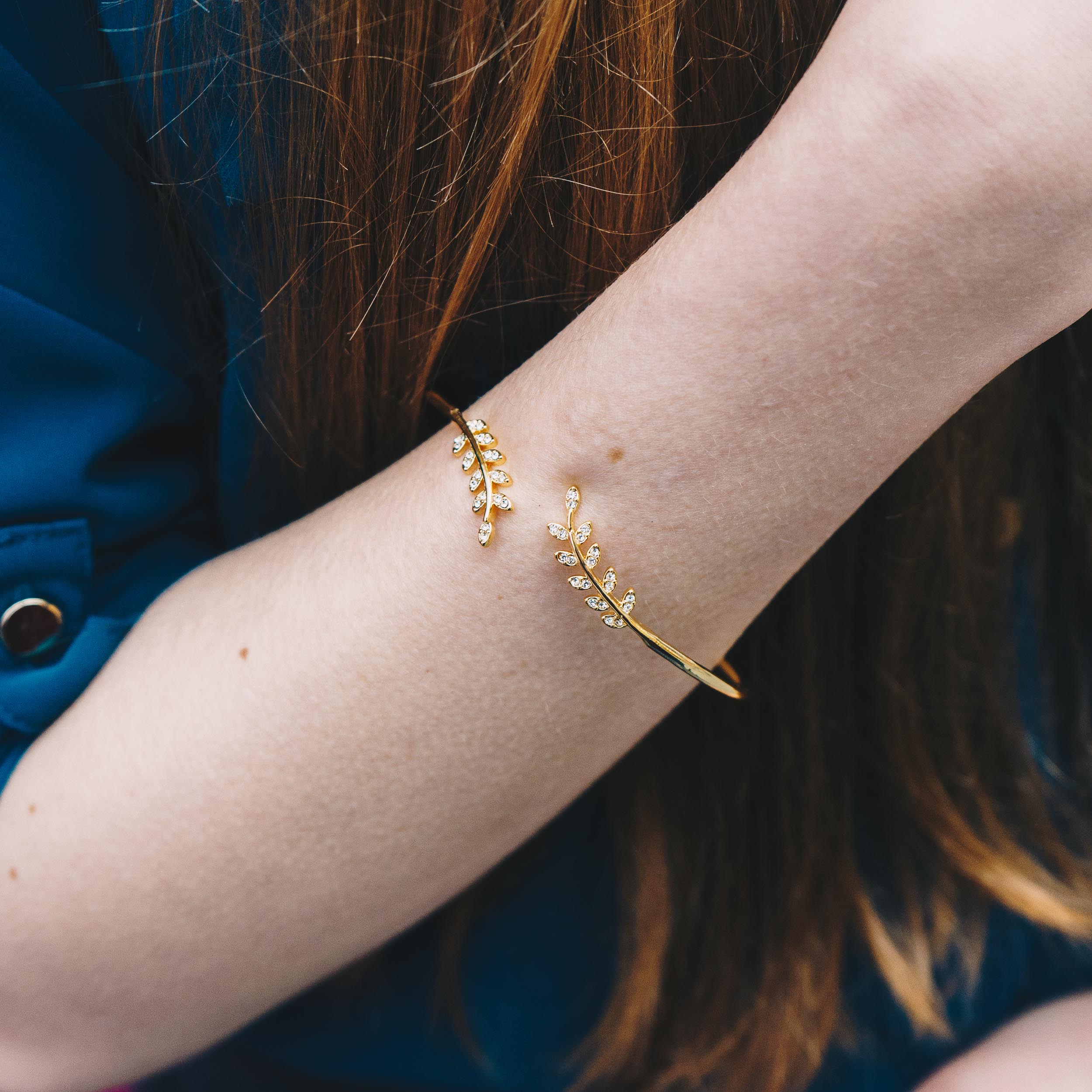 Gold Plated Leaf Bangle Created with Zircondia® Crystals