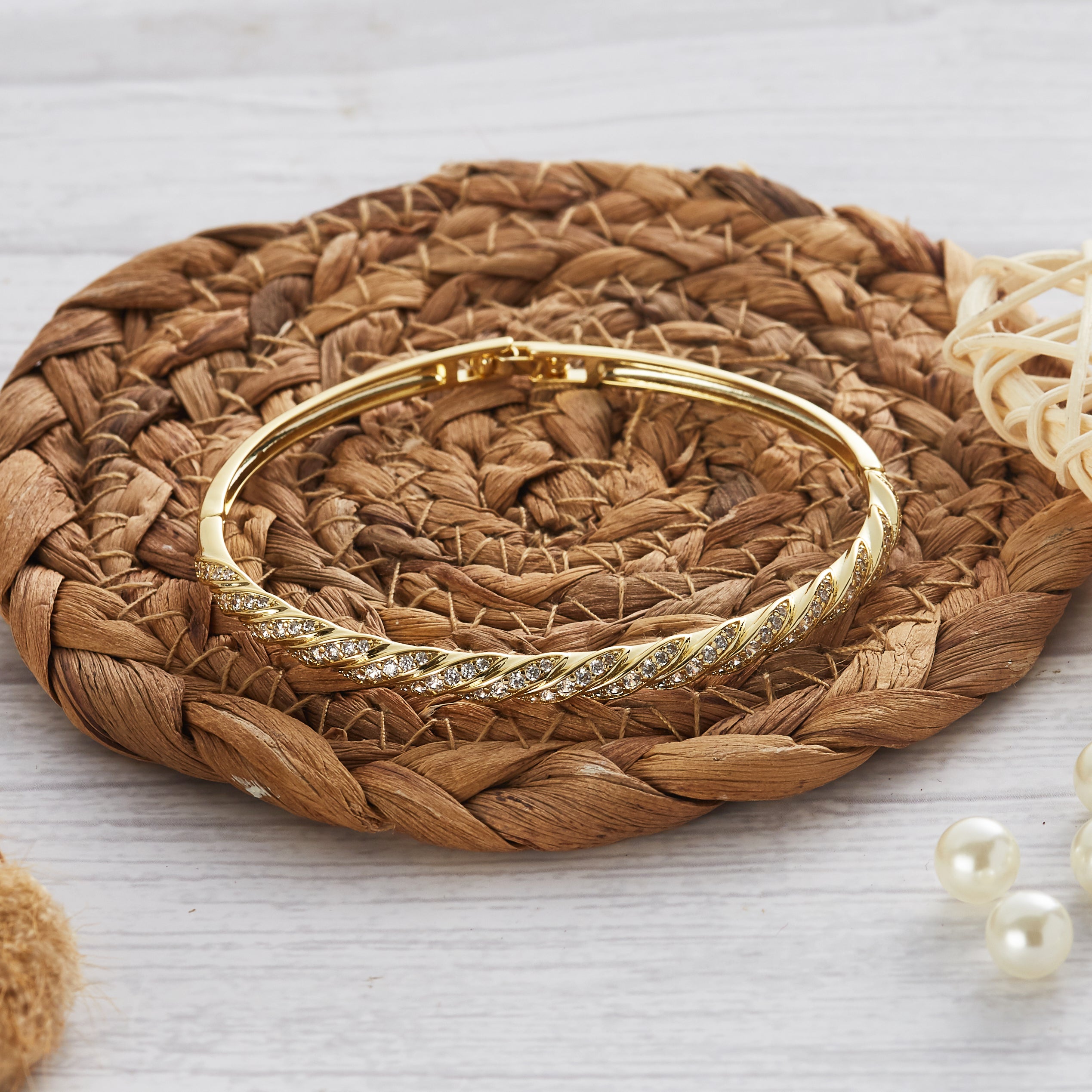 Gold Plated Twist Bangle Created with Zircondia® Crystals