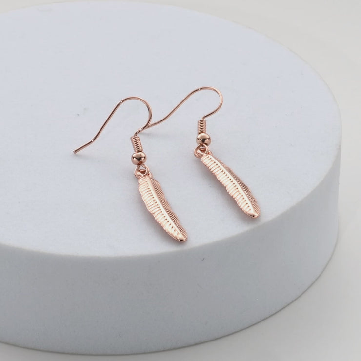 Rose gold feather stud on sale earrings