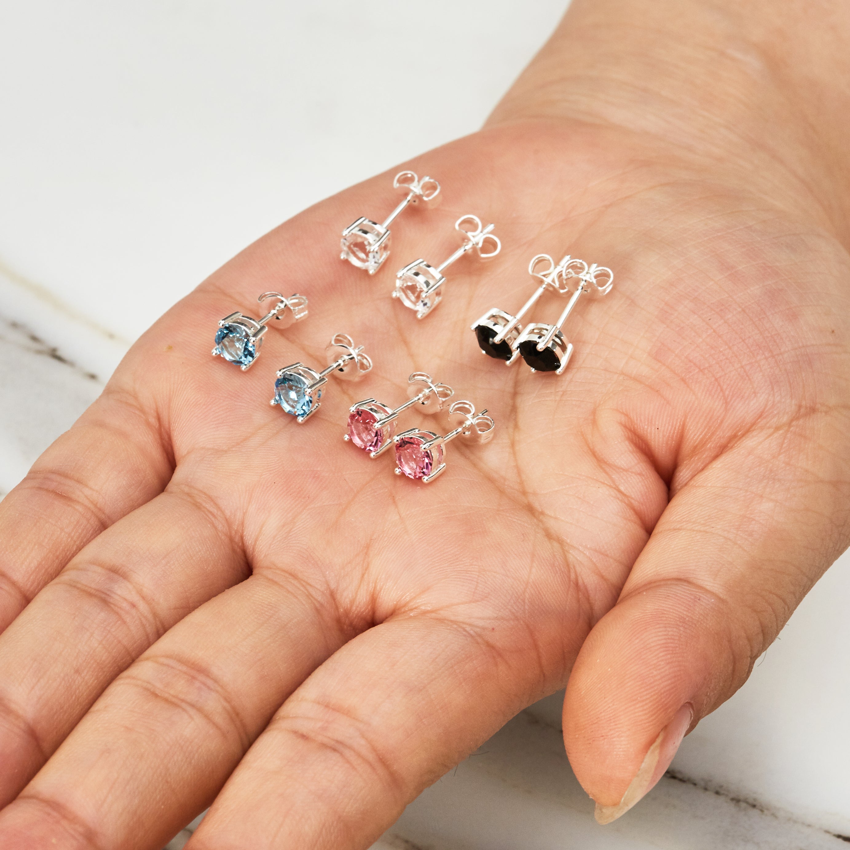 Four Pack of Solitaire Earrings Created with Zircondia® Crystals