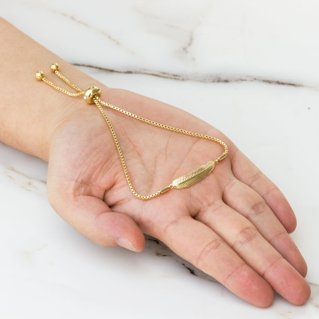 Gold Plated Feather Friendship Bracelet Created with Zircondia® Crystals - Philip Jones Jewellery