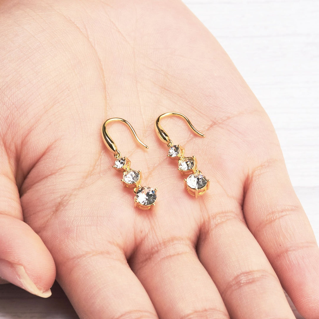 Gold Plated Graduated Drop Earrings Created with Zircondia® Crystals - Philip Jones Jewellery