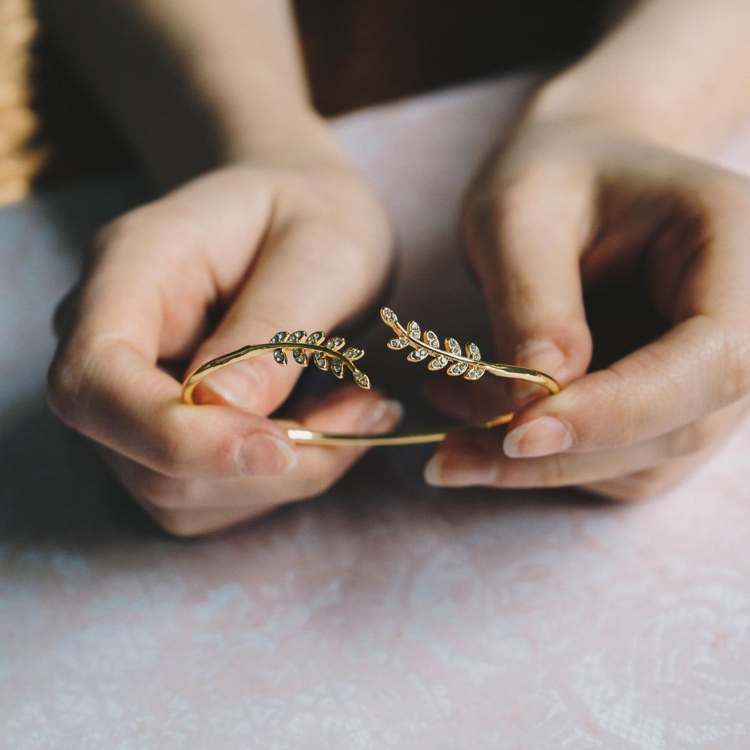 Gold Plated Leaf Bangle Created with Zircondia® Crystals - Philip Jones Jewellery