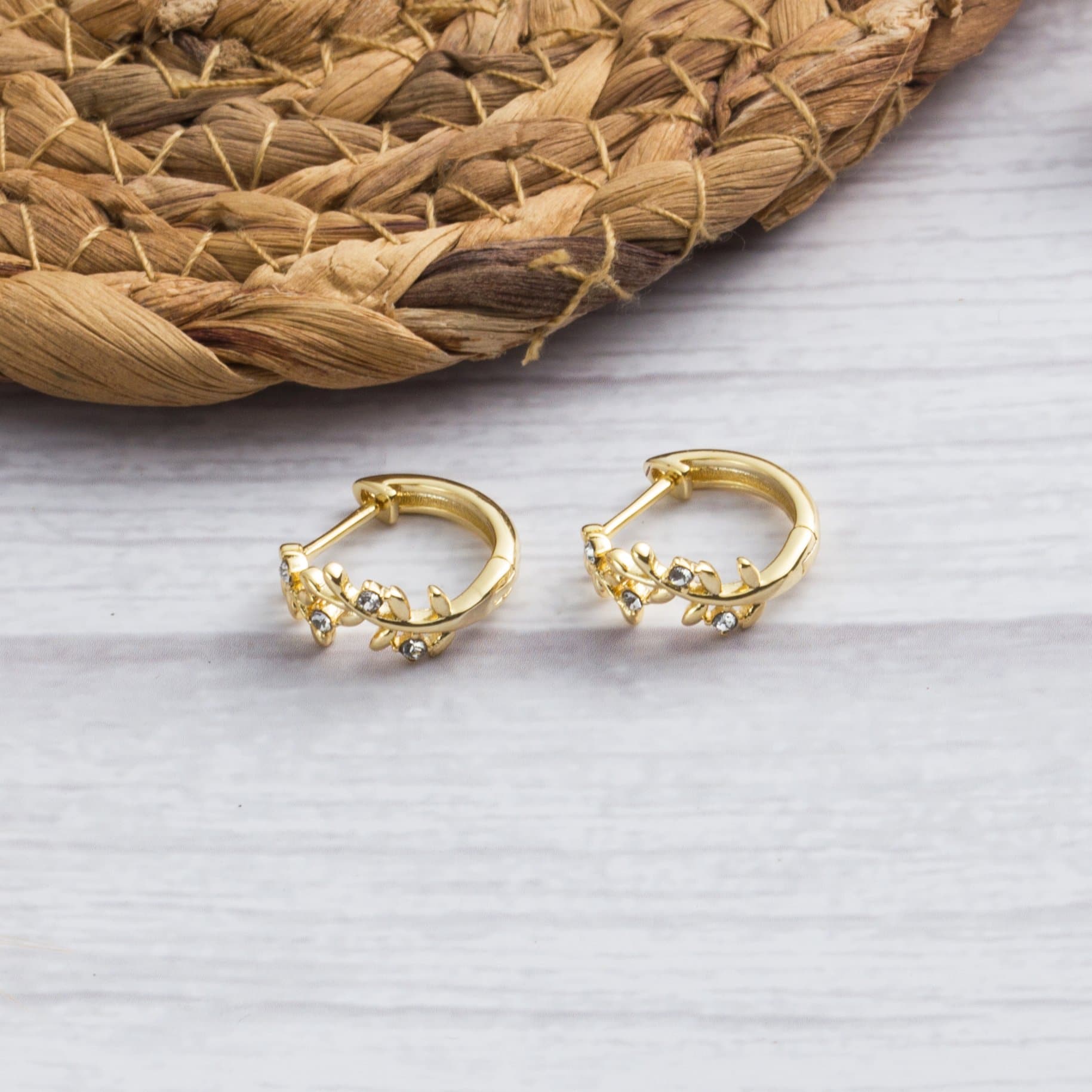 Gold Plated Leaf Hoop Earrings Created with Zircondia® Crystals - Philip Jones Jewellery