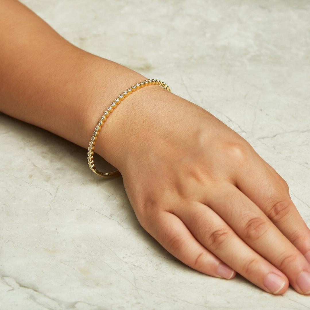 Gold Plated Tennis Bangle Created with Zircondia® Crystals (7 Inch) - Philip Jones Jewellery