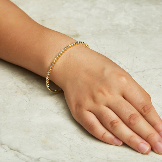Gold Plated Tennis Bangle Created with Zircondia® Crystals (7 Inch) - Philip Jones Jewellery
