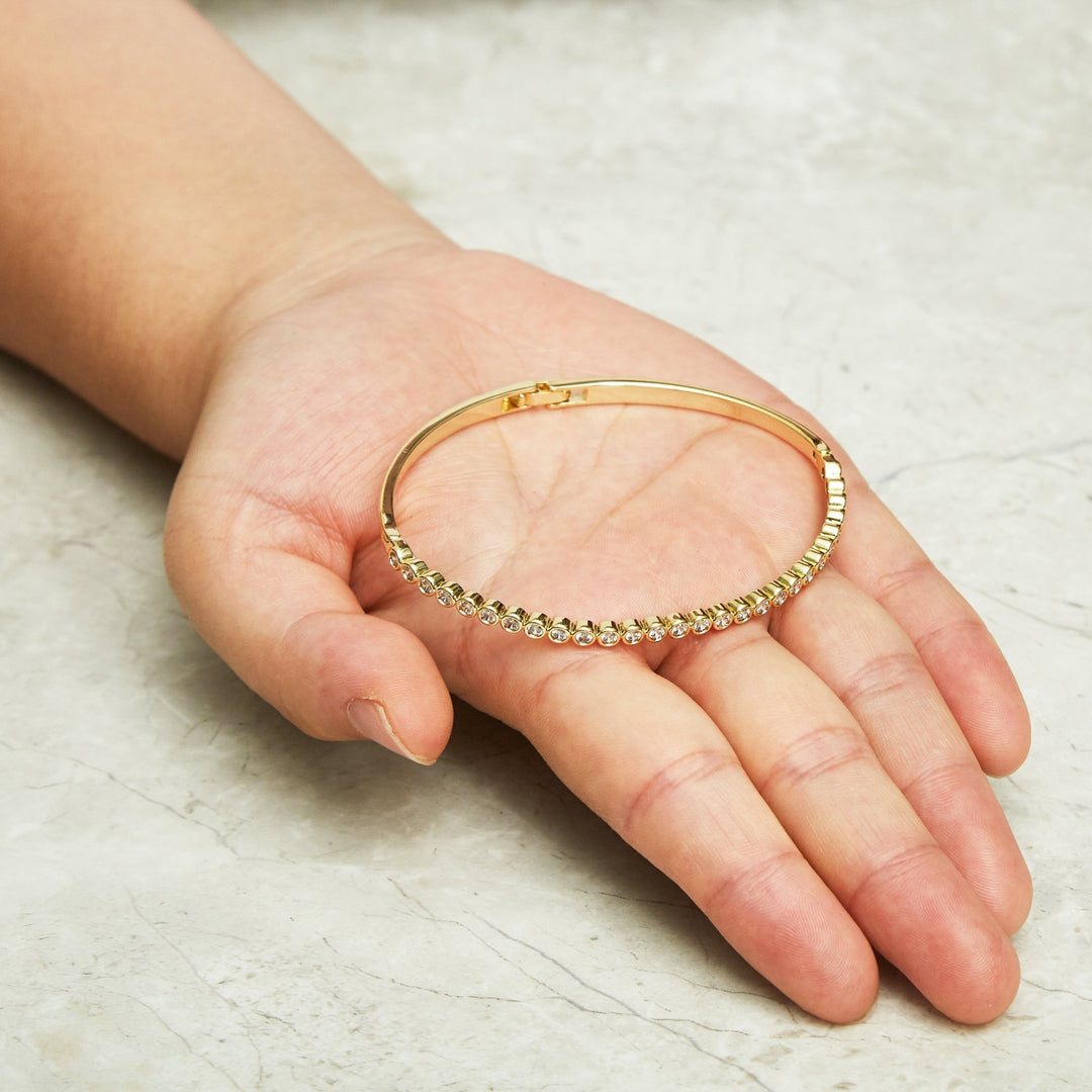 Gold Plated Tennis Bangle Created with Zircondia® Crystals (7 Inch) - Philip Jones Jewellery