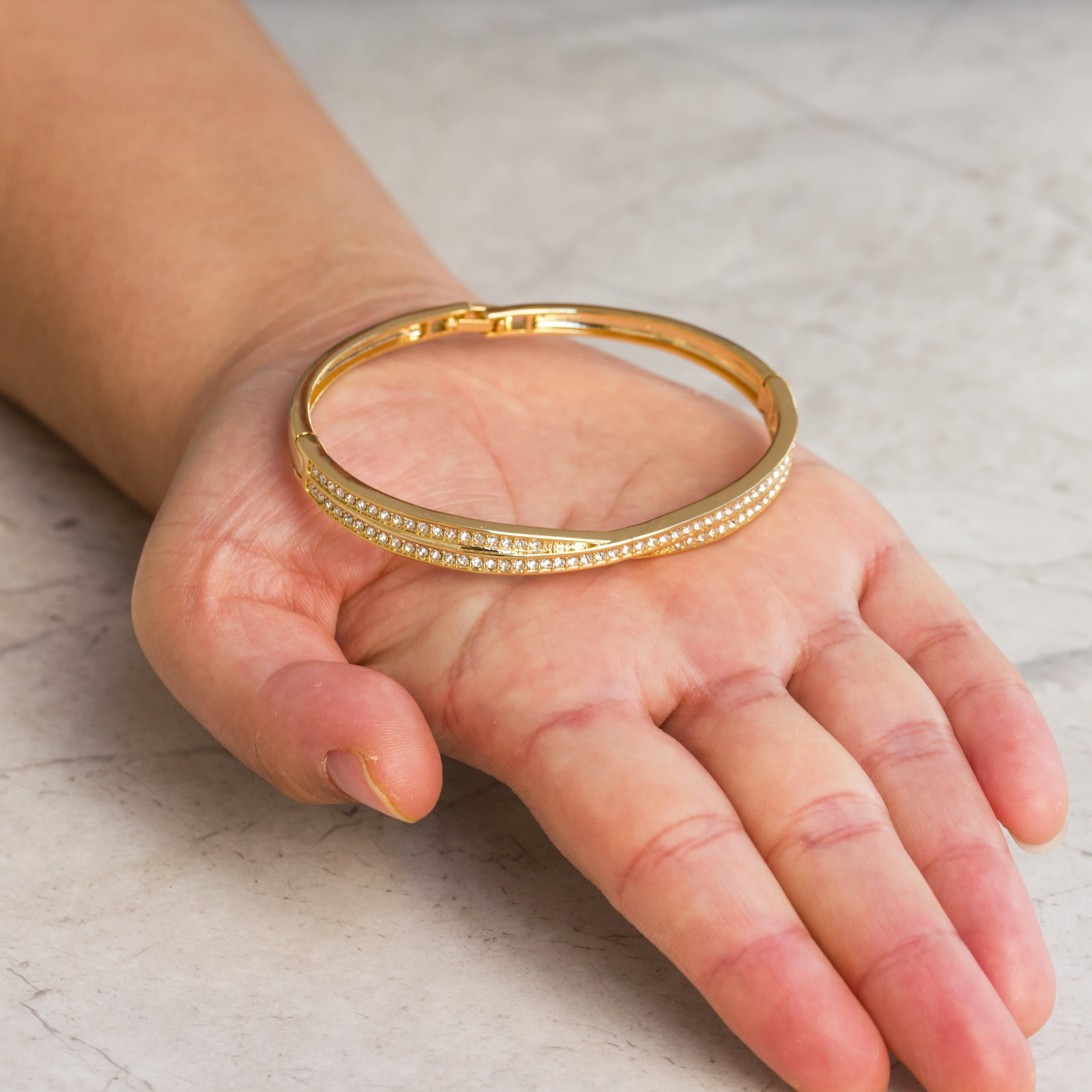Gold Plated Crossover Bangle Created with Zircondia® Crystals