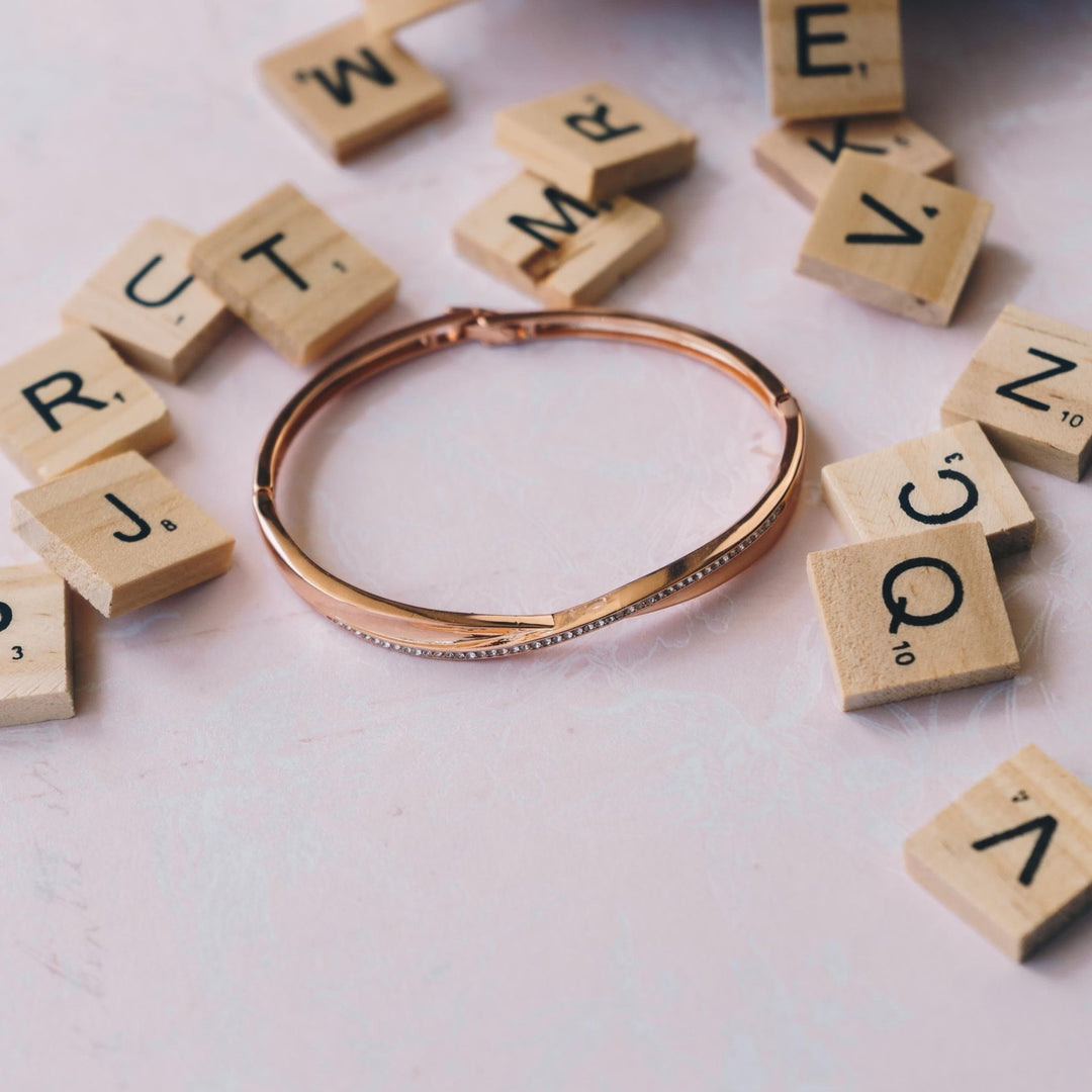 Rose Gold Plated Arc Bangle Created with Zircondia® Crystals (7 Inch) - Philip Jones Jewellery