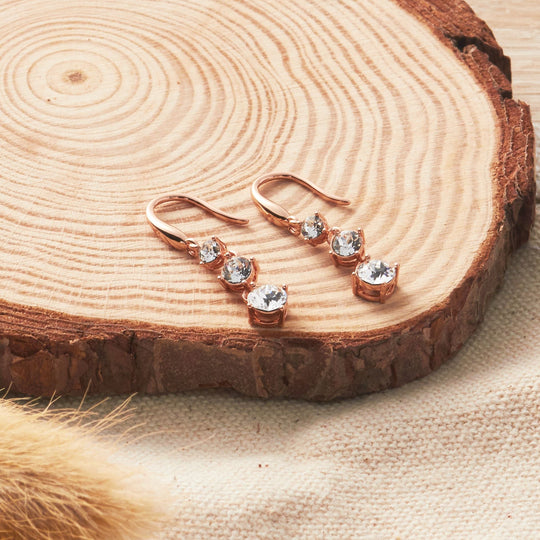 Rose Gold Plated Graduated Drop Earrings Created with Zircondia® Crystals - Philip Jones Jewellery