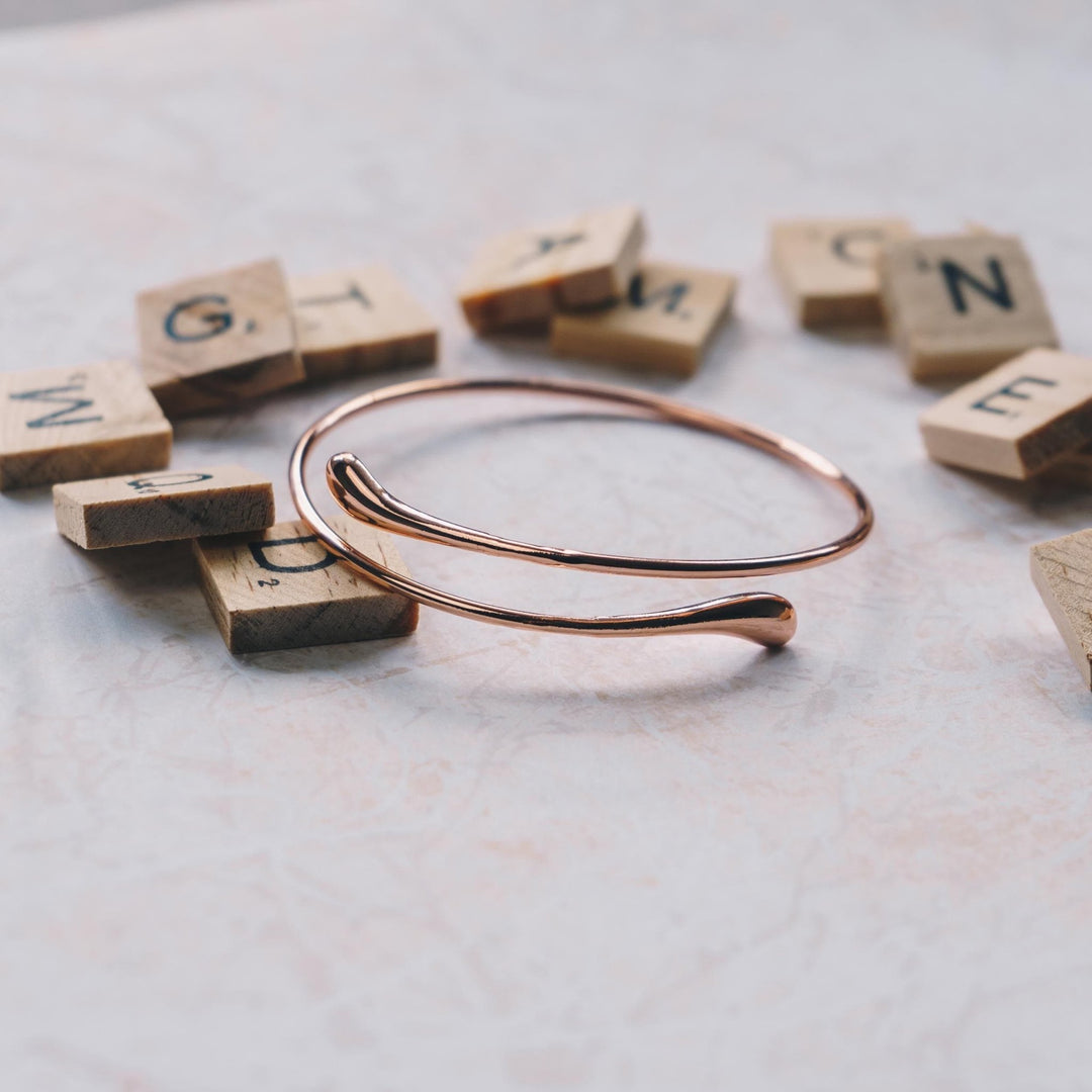 Rose Gold Plated Teardrop Bangle - Philip Jones Jewellery